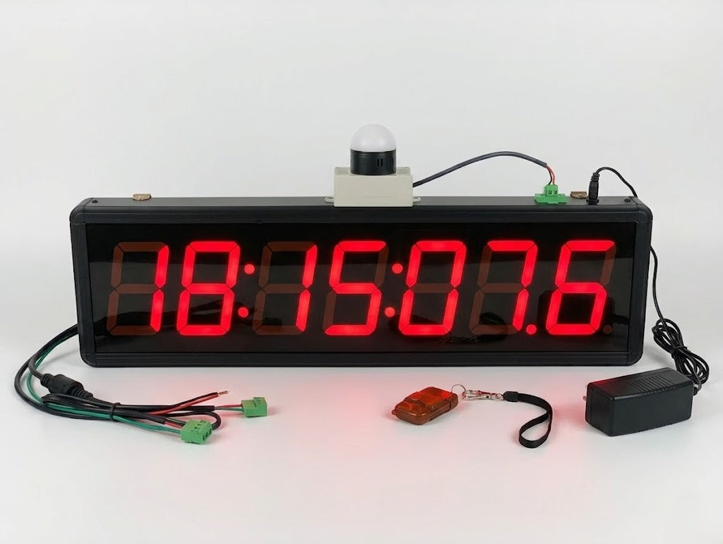 Digital clock with red LED display on a white background