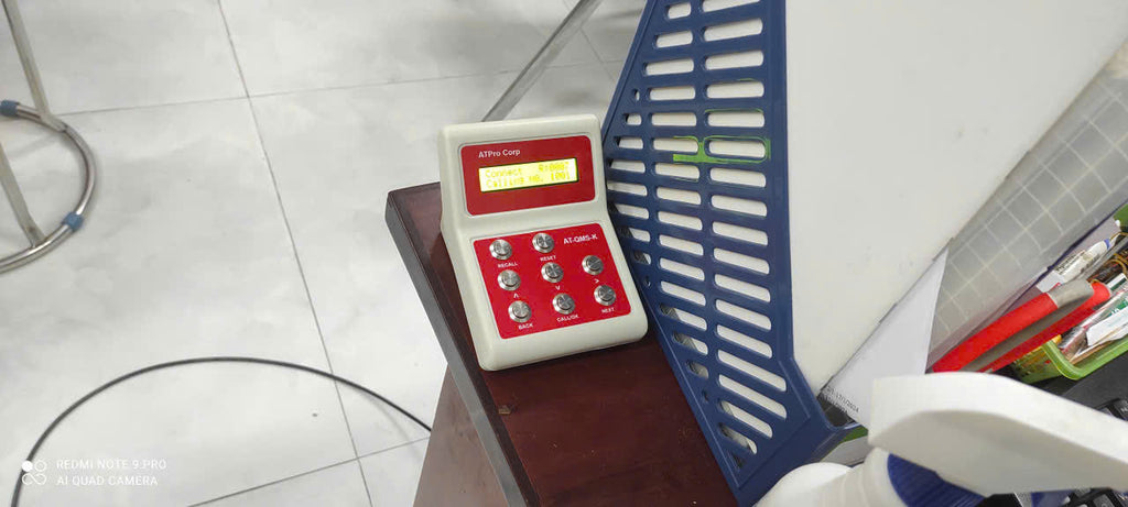 Control panel with red and white buttons on a metal surface