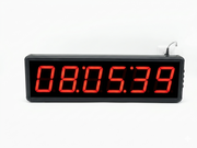 Digital clock with red LED display on a white background